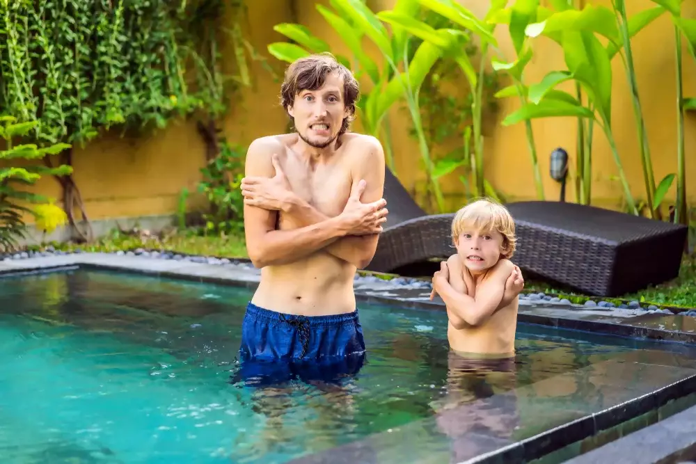 Father-and-Son-feel-cold-in-their-swimming-pool-Get-Pool-Heating-System-to-get-your-pool-warm
