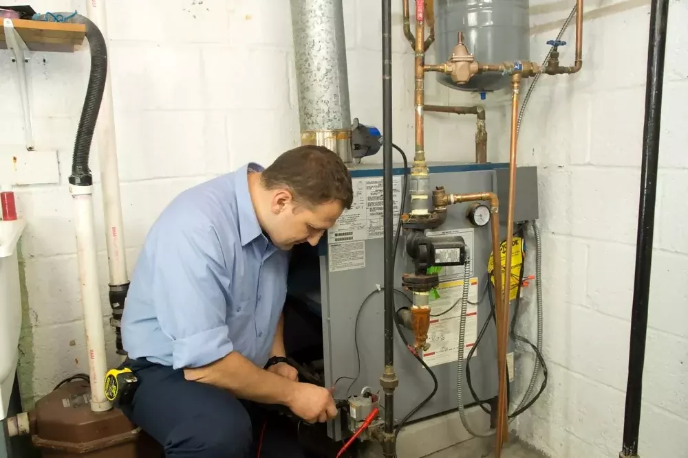 Technician-fixing-furnace-to-improving-Heating-Problem